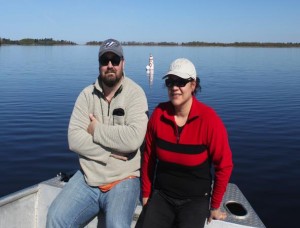 Dr. Krys Chutko and Jamie Lavigne pose with the newly installed buoy in June 2013.